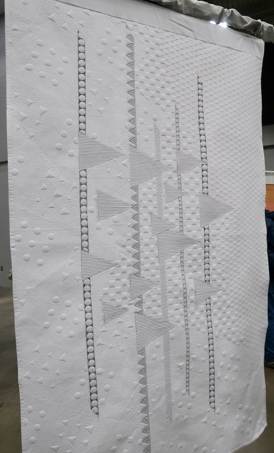 "Deportation" by Jackie Benedetti, quilted by Rachael Dorr - Back